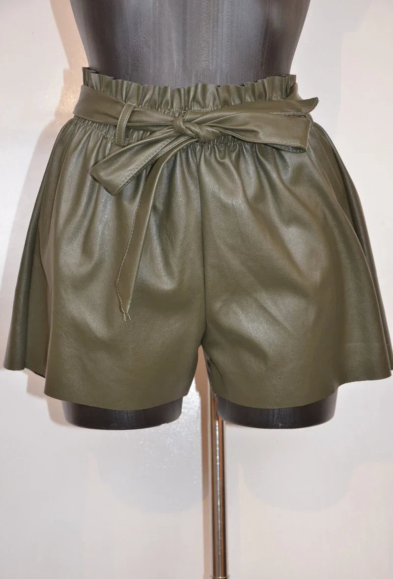 High-waisted faux leather shorts with tied belt